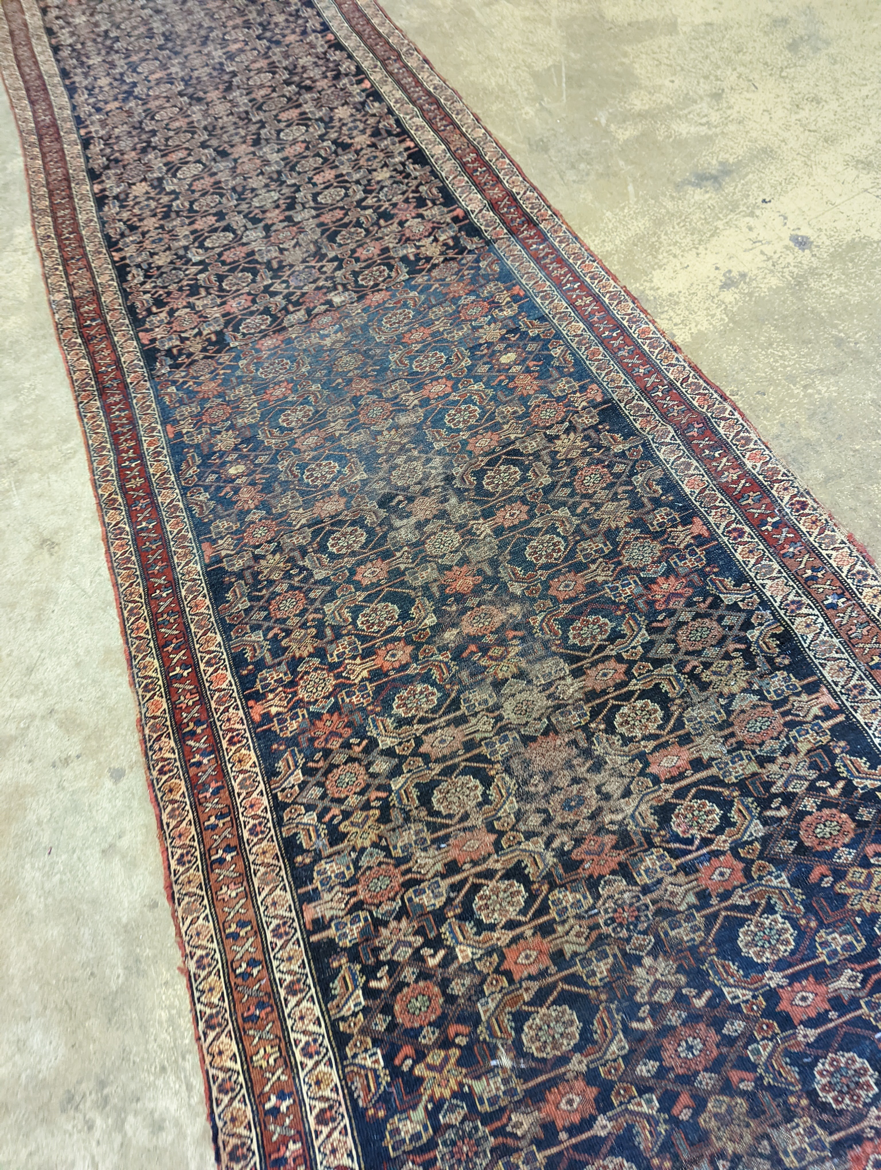 An antique Shirvan blue ground runner, 470 x 116cm